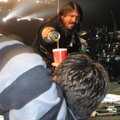 Just Dave Grohl pouring a fan some beer