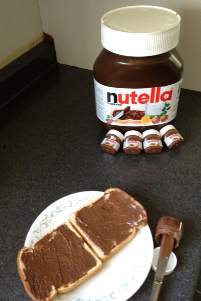 A rare sighting of a mother Nutella protecting her young as they watch on their little brother get smeared on toast..... - meme