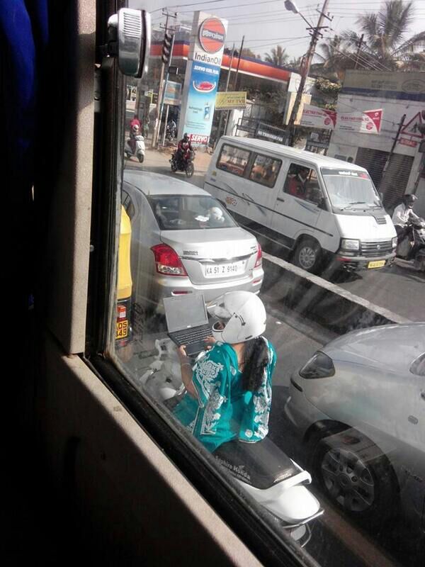 using laptop in traffic like a boss! only in India. lol - meme