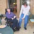 Stephen Hawking driving with his wheelchair over Jim Carrey's foot :D