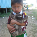 Just a kid and his happy pet sloth (: