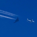 A stealth bomber in comparison to a Boeng