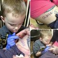 One brave man letting his son tattoo his name on him